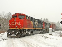 Engineman Wayne Sykes braces against the cold wind as he