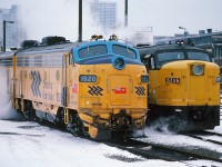 So where did Via Rail get the yellow in that blue and yellow livery? Contrasting cabs: ONR's GMD built FP7-A #1520 (with 1515) in ON's circa 1974 Chevron blue & yellow scheme poses beside Via Rail's MLW built (for CN) FPA-4 #6765 in Via's circa 1976 (?) b & y. CN Spadina Shop January 15, 1983. Kodachrome by S.Danko.
