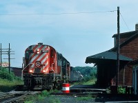 At 15:55 on August 26, 1984 witness CP Rail extra #8737 at Blind River, Ontario. 
Being not familiar with this territory, can someone confirm the direction of travel? Status of the station? 
<br>
Somewhat surprised by this find (and given that it was expected most movements would be at night)hence unable to record that second leased unit nor the third. 
I believe the Budd car was discontinued about 6 years prior (?). 
( Irritation: Has anyone noticed that once the passenger subsidy ends (train discontinued) that the track deteriorates, and in some situations eventually the freight carrier shows up cap in hand for public (yours and mine) money to fix the freight tracks to allow continued freight service sans passenger service?). 
Kodachrome by S.Danko.
