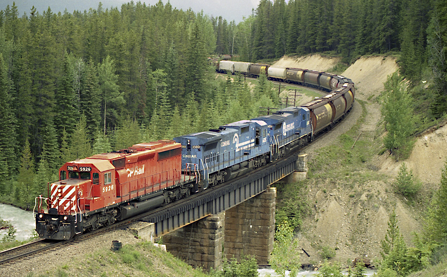 SD40-2 #5926 leads 2 leased Conrail GE's over the bridge at Ottertail BC.
