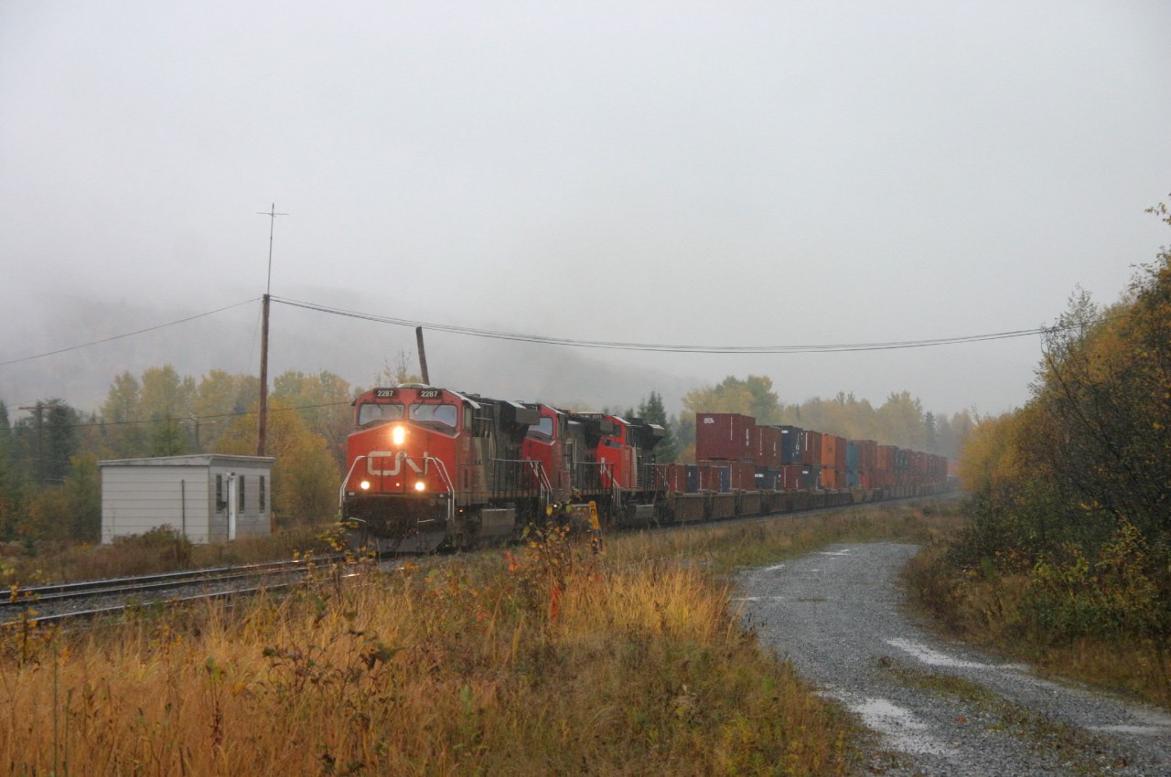 CN 121 arriving at Pelletier Jct , with the former Monk sub , on heavy rainy morning !