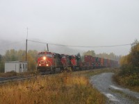 
CN 121 arriving at Pelletier Jct , with the former Monk sub , on heavy rainy morning !