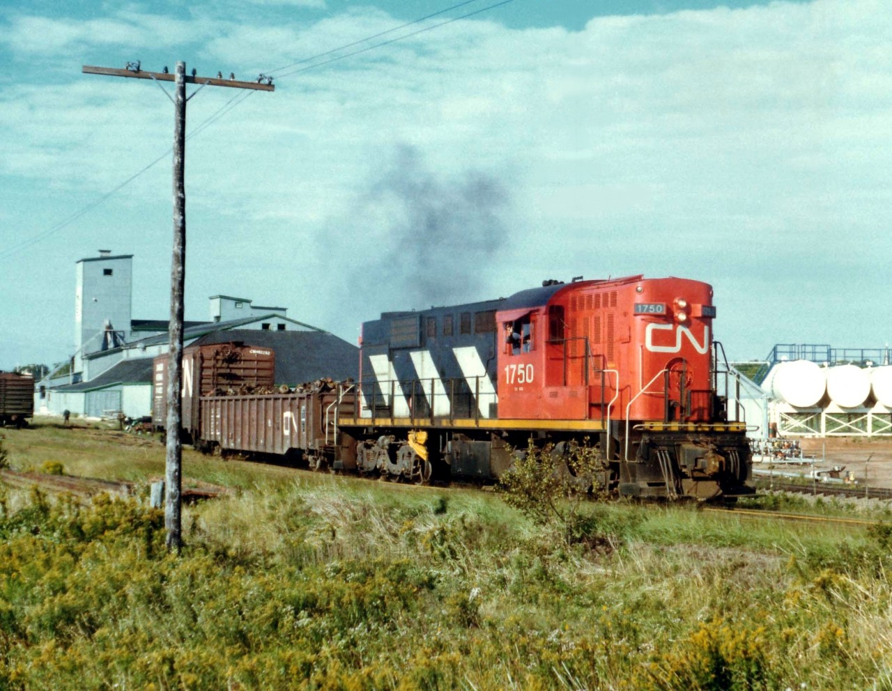 CN's RSC-18 #1750 switches industry along the waterfront area of Summerside, PEI on a pleasantly warm September 16, 1977.
Railroading ended on the Island in late 1989.