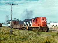 
CN's RSC-18 #1750 switches industry along the waterfront area of Summerside, PEI on a pleasantly warm September 16, 1977.
Railroading ended on the Island in late 1989.