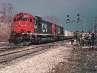 With sincere apologies to James Adeney and his CN 2030 Alco image (id=7232), the resistance to submit this photo was futile, and so here is the opportunity for James and others to see the Master in Action (big grin)....I believe it is he with the checkered coat!!
Bet you do not remember this, James....