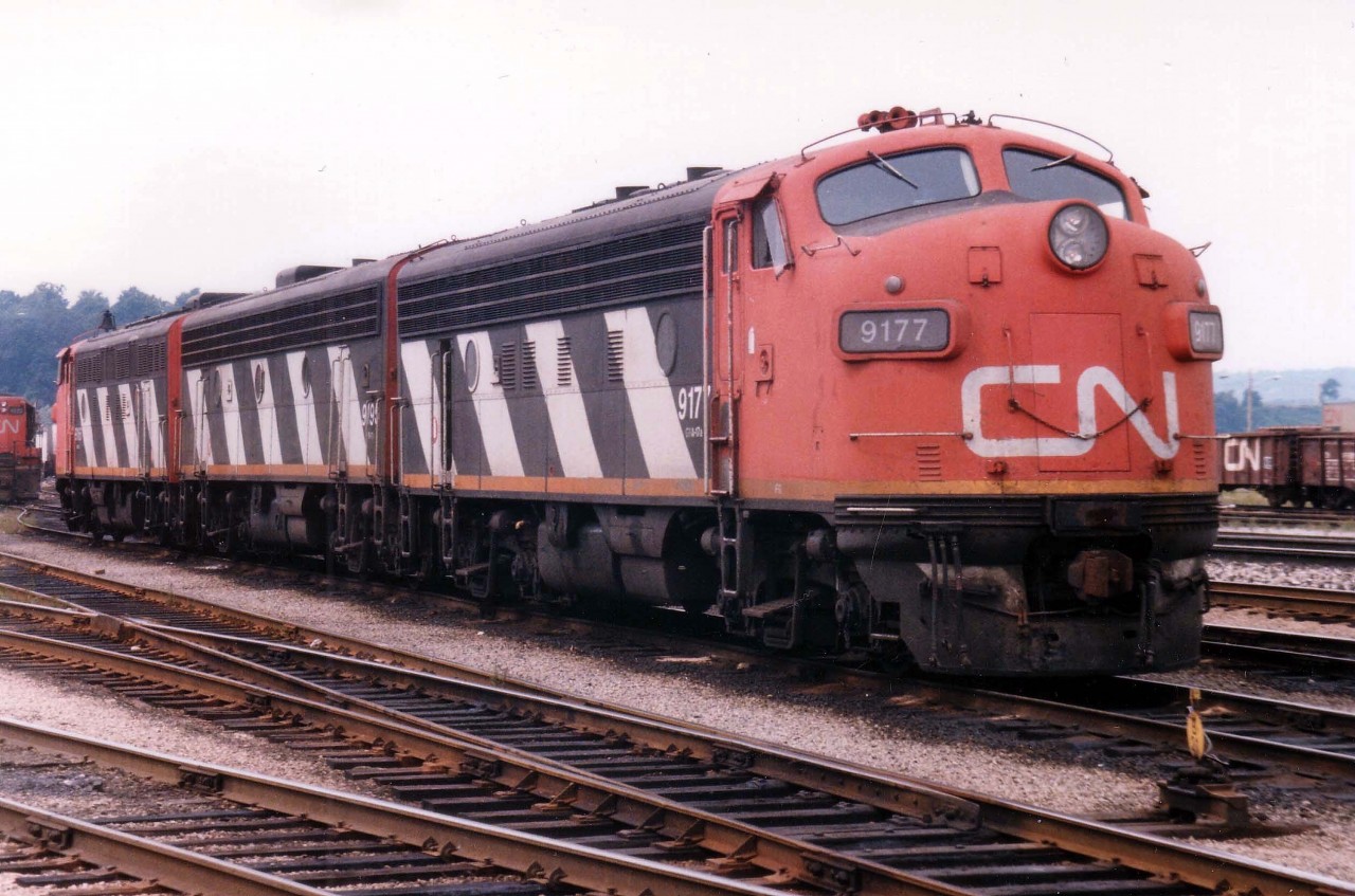 Back in those great days of A-B-A lashups to power the CN version of "The Nanticoke" we have CN 9177, 9195 and 9166 idling by the shop at CN's Stuart St. yard., about ready to put a train together which will be led by 9166 down to Nanticoke and the 9177 returning.  The 9177, retired by 1989 and eventually going to National Railway Equipment; has made the news as one of the F units recently acquired by the Norfolk Southern for use on the Executive Fleet.