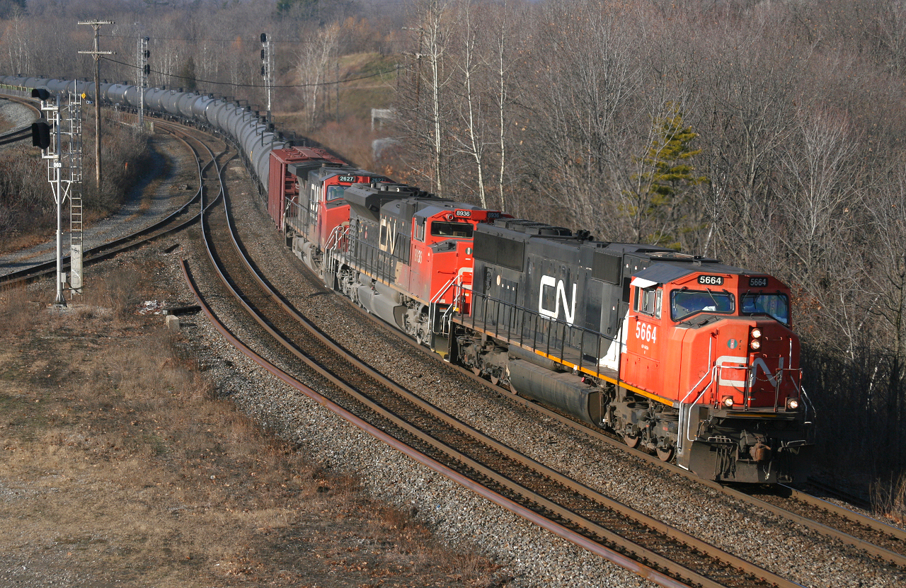 CN U700 the first unit crude oil train to operate on the CN across Southern Ontario rolls through Bayview on a beautiful December morning.  This train originated on the BNSF in North Dakota and is bound for the NBSR in Saint John, New Brunswick.  These trains used to operate over a CSX-Pan Am-MMA-NBSR routing, however should start operating regularly over CN if this test run proves successful.  The consist today is CN 5664, CN 8936, CN 2627 with 1 spacer and 95 tank cars for 5,690ft and weighs in at close to 12,900 tons.