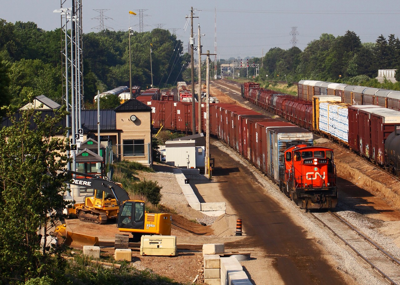 Stopping on my way home after work, I was lucky to catch CN GMD-1 #1444 "leading" the afternoon yard job at Aldershot. The construction equipment to the left was being used to add concrete block walls to various parts of the yard, in addition to the extra track that was being added at the time (just to the right of CN 1444).