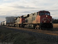 Crusing east on the new tripple track portion of the Kingston Sub, CN 2275 2140 and mid train DPU 8838 have 376's train well in hand. This is the 2140's second pass through here in under 12 hours, having brought 371 into Mac yard solo in the morning. 1544hrs.