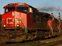 CN 2569, 5727 and a second SD 70 roll through the north track at Brantford in the evening sun.