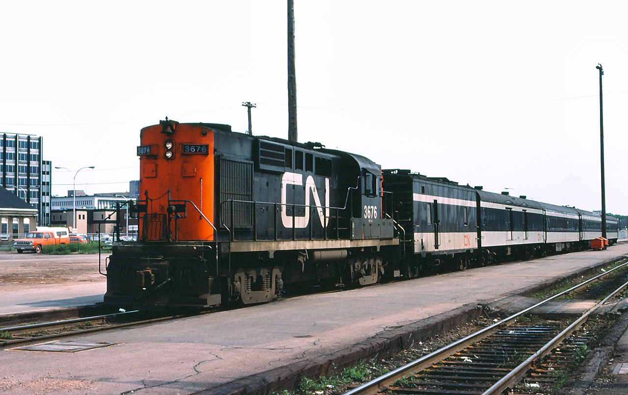 Train 611 sits at the Moncton Station with CN 3676 on the point