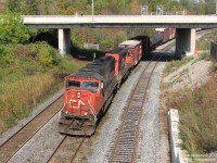 It's not a passenger train drawn by an FPA4, or a hotshot with 4 CN GP9's, but the standard-issue modern Bayview freight of the 21st century. Westbound on train 435, CN SD75i 5744 and IC SD40-2 6256 round the bend and make a run for the hill at Bayview Junction, from the usual foamer vantage point of the Royal Botanical Gardens bridge. While a few changes have occurred in the area, including triple tracking, modern signals and CTC, at Bayview a train is still a train, and the cameras present make their usual noises as it passes by.