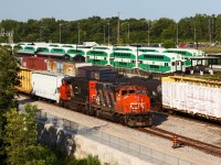 CN 4784 and 4770 go about sorting cars on the lower lead while two GO trains get ready to depart the Aldershot station, one going west for Hamilton, and the other back to Willowbrook.