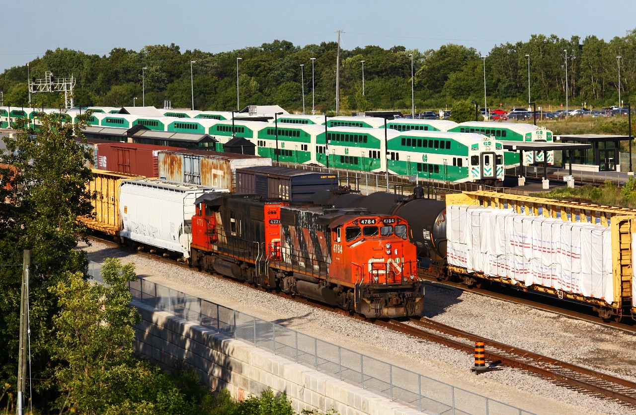 CN 4784 and 4770 go about sorting cars on the lower lead while two GO trains get ready to depart the Aldershot station, one going west for Hamilton, and the other back to Willowbrook.