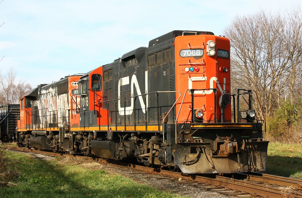 Cn 7068 and 4721 are switching cars at the CN/CP interchange.