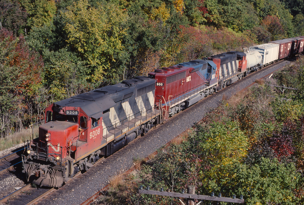 CN's original 'Tunnel Motors' prior to the acquisition of the DMIR and BLE were the 9300 series GP40s, which were typically assigned to Sarnia for service through the Sarnia Tunnel, here we see 9308 leading train 383 through Bayview.