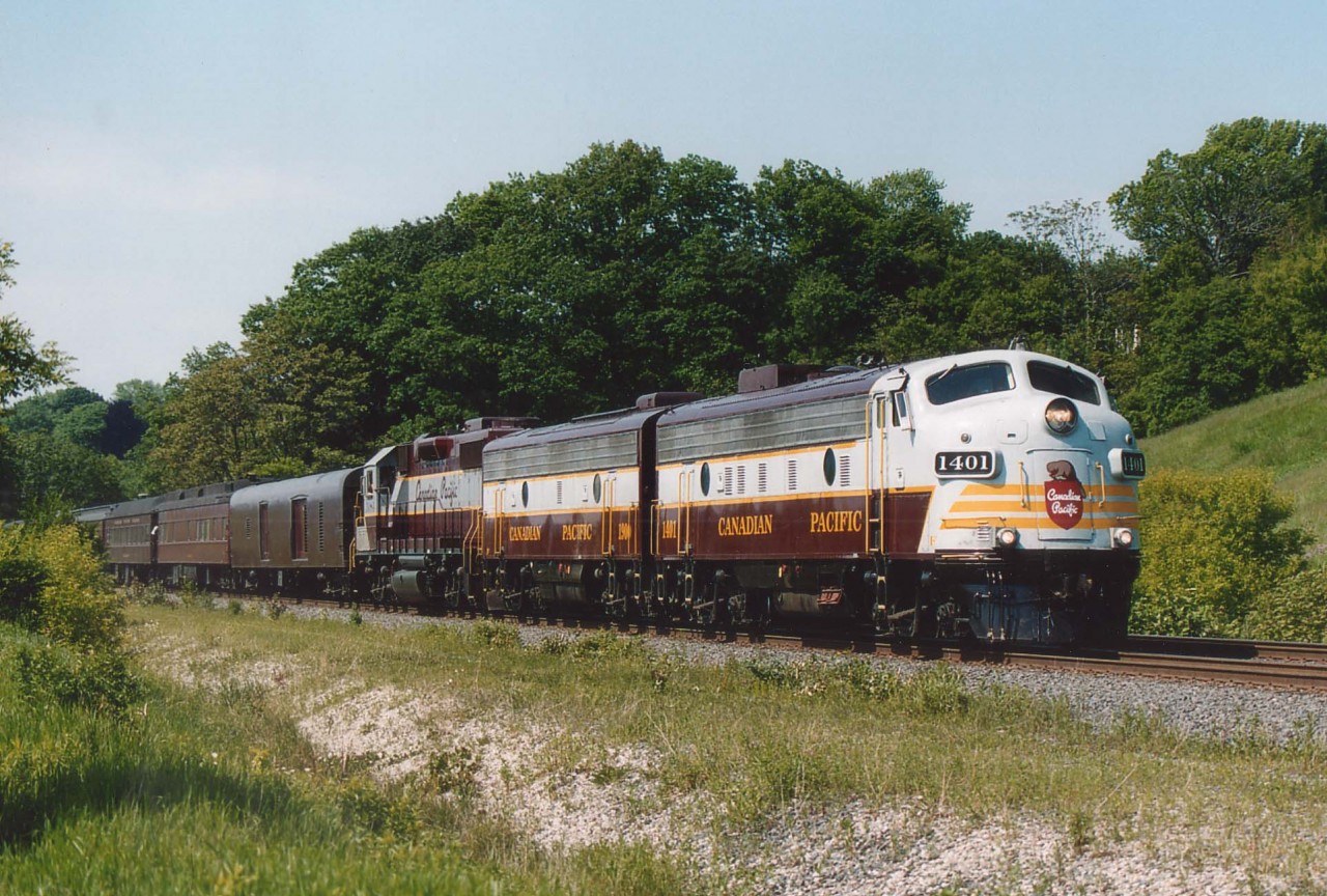 When something as nice as this CP Special roams across the country, the best thing to do is find a location where no other photographers are in the way, which justified this hike into an area between Hwy 403 and the Hamilton Cemetery (up on the hill).
The power is CP 1401, 1900 and 3084.
CP 1401 began life as CN 6541, 1900 as CN 6612 and the CP 3084 was repainted in Script in 2000.
This was a perfect afternoon for a perfect train. Right, James?