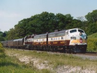 When something as nice as this CP Special roams across the country, the best thing to do is find a location where no other photographers are in the way, which justified this hike into an area between Hwy 403 and the Hamilton Cemetery (up on the hill). The power is CP 1401, 1900 and 3084. CP 1401 began life as CN 6541, 1900 as CN 6612 and the CP 3084 was repainted in Script in 2000. This was a perfect afternoon for a perfect train. Right, James?