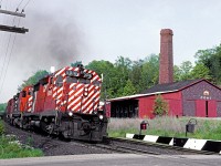 CP 5016 with sulphuric acid train 937 and trailing units 4221 and 4226 lean into the curve at mile 38 on the CP's Galt Sub.