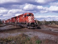CP 6002 with the 434 south hits the CN diamond at St Cloud, Ontario. 9/17/2008
