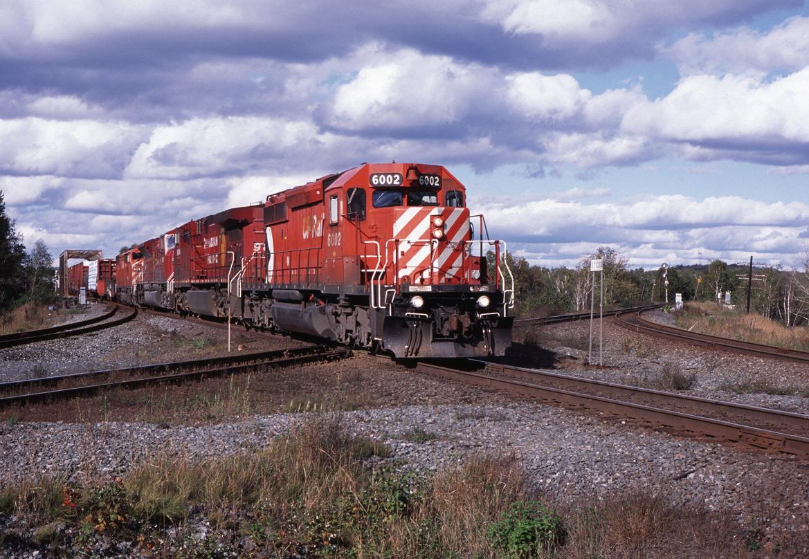 CP 6002 with the 434 south hits the CN diamond at St Cloud, Ontario. 9/17/2008