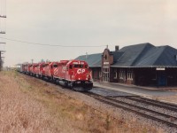 Due to problems at the Hunter St tunnel in Hamilton on the TH&B/CP trackage (Hamilton Sub.) a handful of CP trains were detoured over the CN in the last few days of October 1994. Here we see CP's #526 with CPRS 6411, CP 5534, CPRS 5606, CP 5669, 5755 and 5668 which will be heading Stateside via the Niagara Falls CN bridge in the late afternoon.