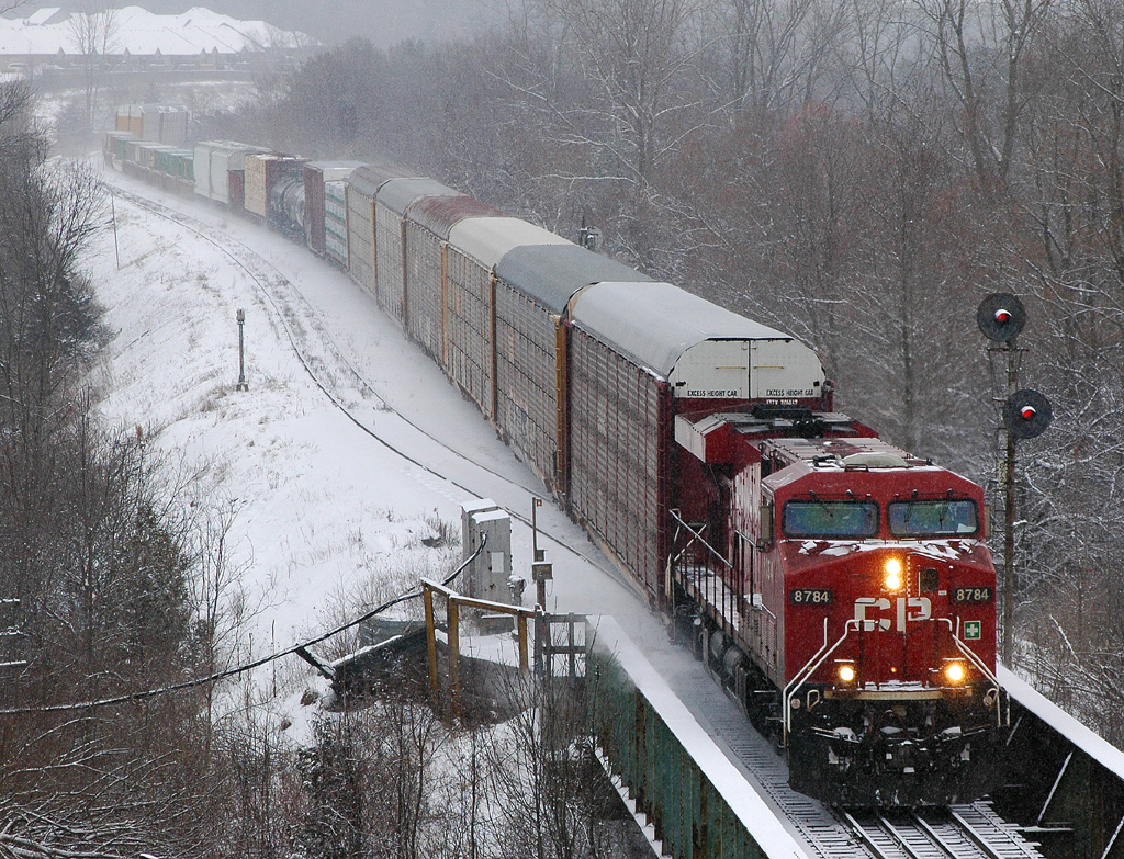 CP 8784 West about to cross the Thames River on it's way to meeting 242 at Nissouri