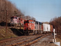  Southbound CN 5522,5501 idles at Dock Siding as CEFX 124, CP 6058, 5903 roars by.