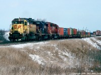 Wearing one of the fabulous temporary CP images during the St. Lawrence and Hudson era, CP 5425 leads HATX 806 and CP 5612 on 503's train west of Bowmanville. On this day, 503 didn't carry the usual head end tank cars of lime slurry from Omya at Glen Tay. A worn piece of junk, a clapped out rent-a-wreck, and a road-weary CP vetran; no wonder they called the SLH the 'Short Line to Hell'. 1255hrs.