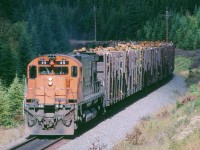 Cartier 49 south bound at mp23 with a log train. North of Port Cartier QUE. 9/18/2001

With a single MLW unit, the sound is VERY close to the sound of a steam locomotive working, Here is my Youtube video of the scene. Enjoy, http://www.youtube.com/watch?v=CkEFYBsTTBc