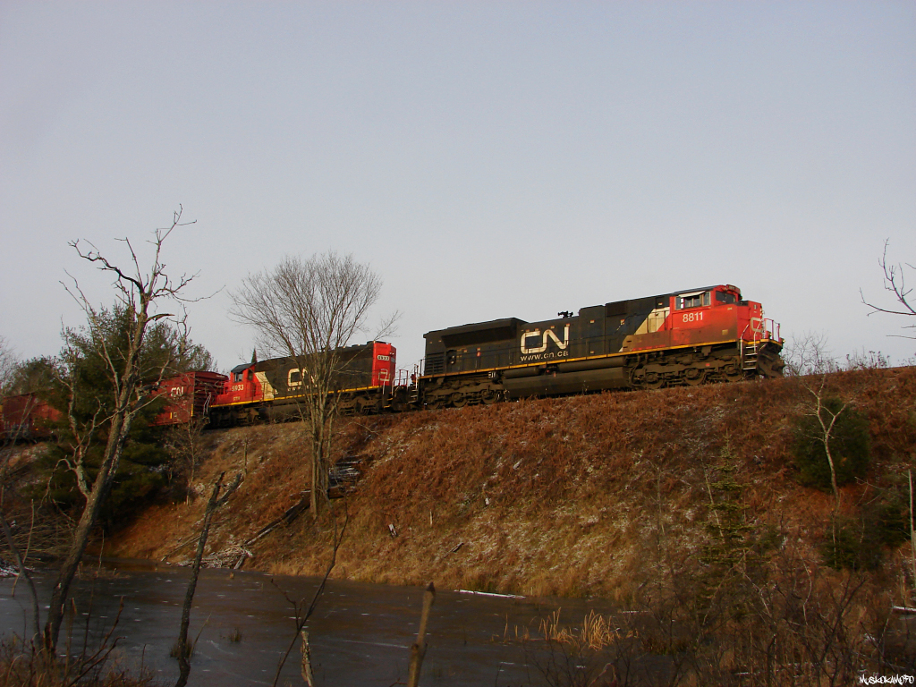 CN A45131 09 - CN 8811 North pulls the throttle back leaving Gravenhurst with CN 8811/GTW 5933 on the head end of 112 cars, 1 for Huntsville, balance for connection with the ONT at North Bay.