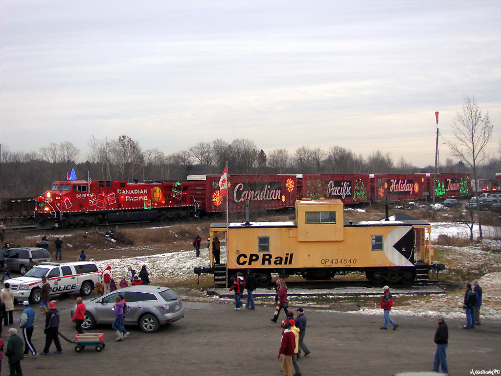 CP 9815 North arrives in MacTier with 01H-28, also known as the Canadian version of CP's Holiday train. Every year in the first few days of December CP puts on a show for the locals of MacTier, drawing most of if not all of the small central Ontario town and inspiring them to give generously for those less fortunate. After a quick show and accepting a few donations, 01H will pack up and move on for a quick stop/show in Parry Sound, and carry on repeating the process on it's trip across Canada.