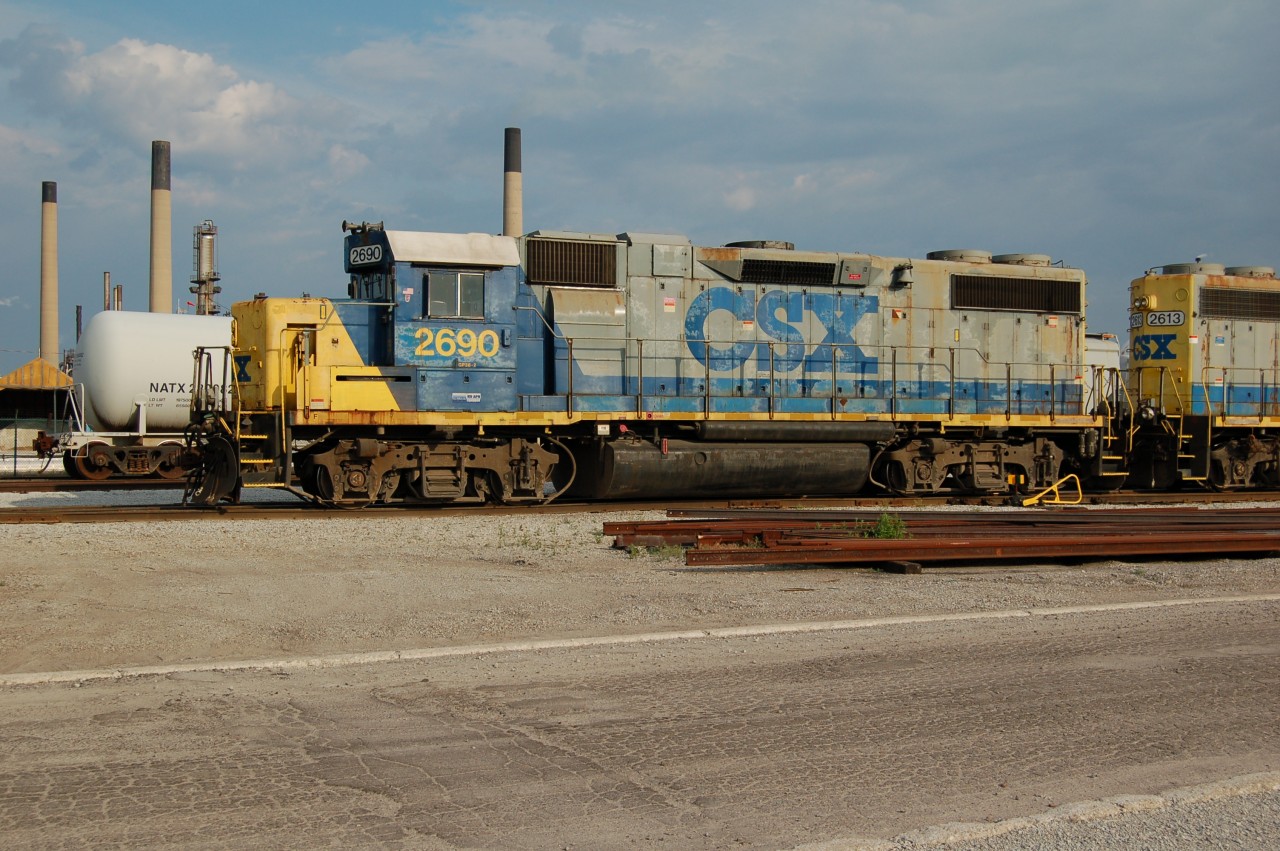 An evening yard job shuffles around the CSX Sarnia yard with district units #2690 and 2613, Imperial Oil stacks loom in the background.