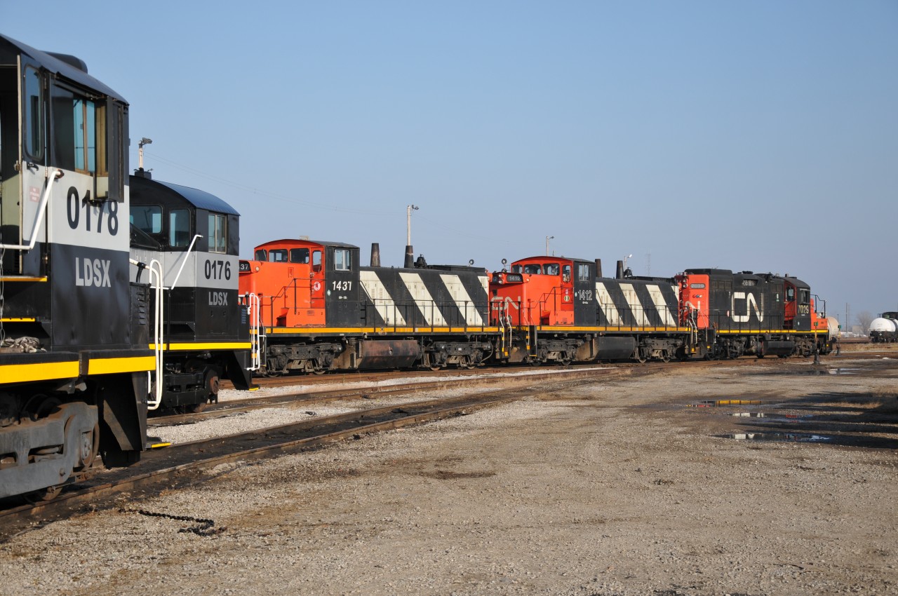 LDS switchers mingle with CN's IOX power. The IOX crew is seen here tacking on an extra geep as per requested for the relieving Terra/Industrial crew to have a remote unit.