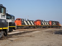 LDS switchers mingle with CN's IOX power. The IOX crew is seen here tacking on an extra geep as per requested for the relieving Terra/Industrial crew to have a remote unit.