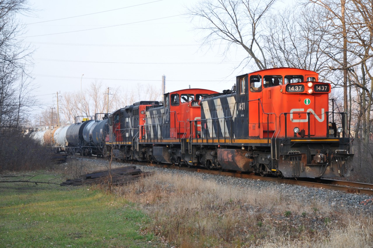 The Terra/Industrial is on the move out of Sarnia. Seen here just after crossing Highway 40/Churchill Road and entering the local indian reserve. The two local GMD1's have been switched around and 1437 now has the lead of this interesting lash-up today.