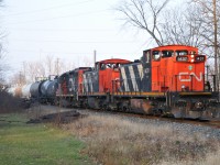 The Terra/Industrial is on the move out of Sarnia. Seen here just after crossing Highway 40/Churchill Road and entering the local indian reserve. The two local GMD1's have been switched around and 1437 now has the lead of this interesting lash-up today.