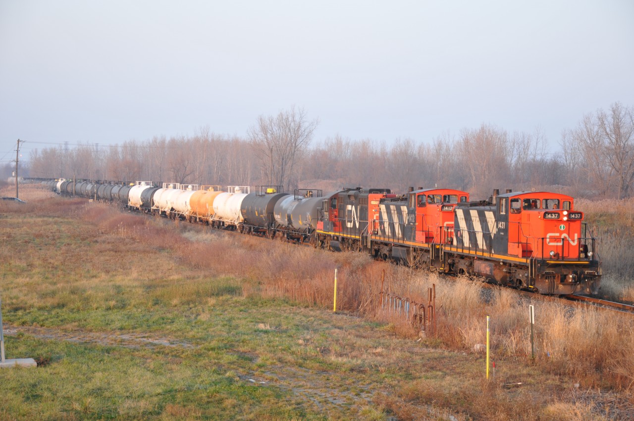 Some last glint of light before sunset as the Terra train moves along over Hill Street in Corunna.