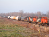 Some last glint of light before sunset as the Terra train moves along over Hill Street in Corunna.