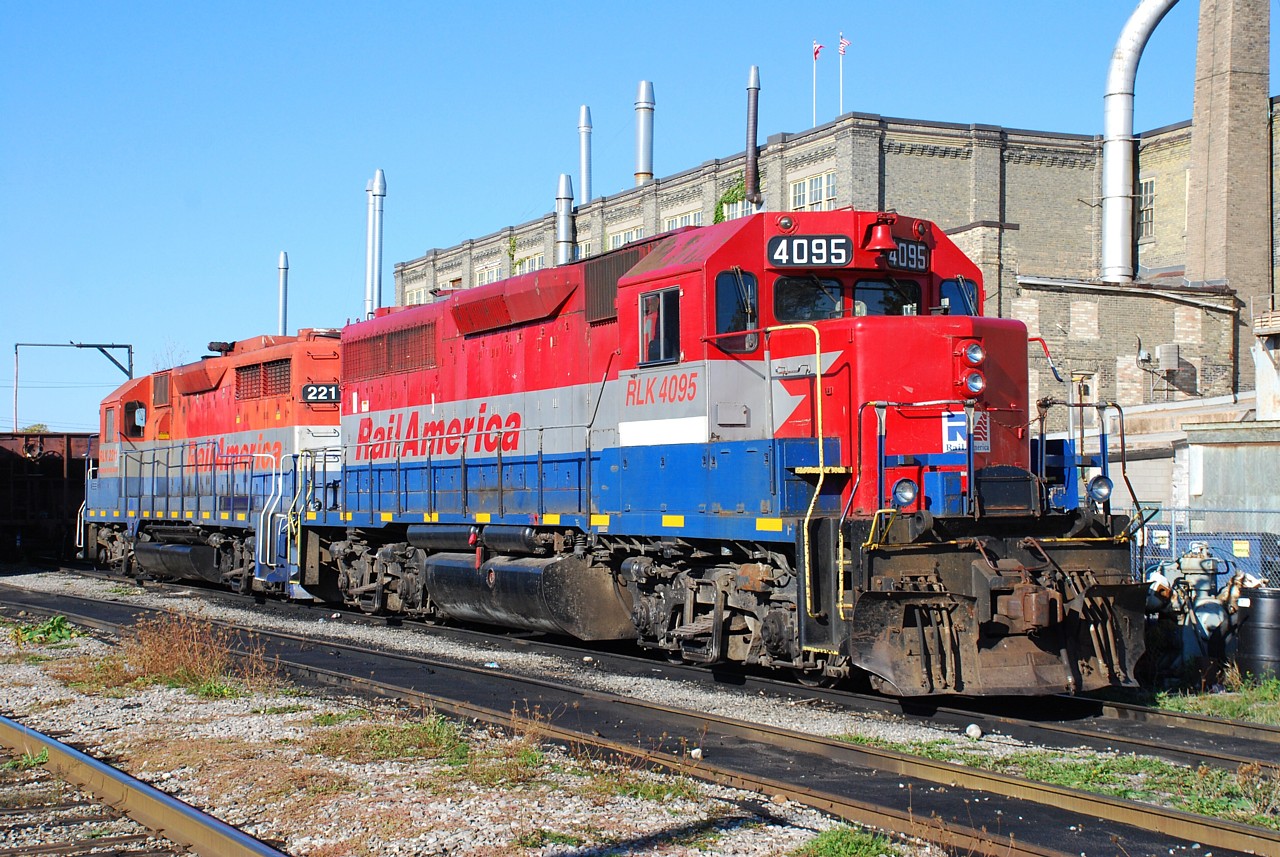 What will become a "fallen flag" scheme in 2013, two RailAmerica painted units sit parked adjacent to the Kitchener station for the weekend.