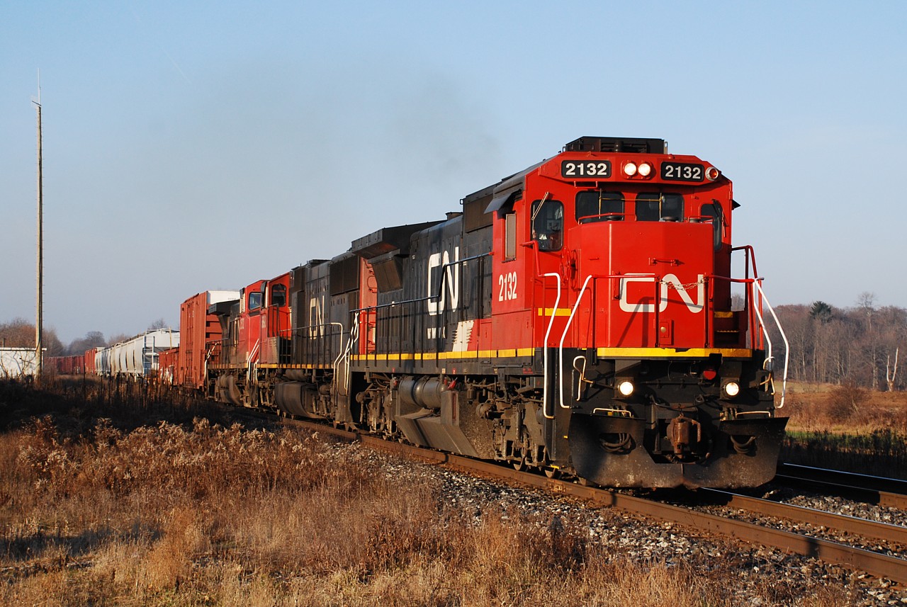CN 396 rolls through Lynden bathed in the low sunlight of a late fall morning.