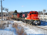 CN 148 cruises in to Brantford the day after a heavy snow storm that caused a lot of "missed connections" in Chicago, as illustrated by all the empty well cars at the head end of the train.