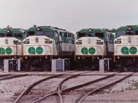 GOT 548, 547, 567 and 545 sit at Guelph Junction awaiting their next assignments.  This photo is no longer possible because GO no longer uses Guelph to park their trainsets.  Photo by Douglas Bishop added with permission of the author.