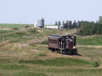 Ogema Sask. based Southern Prairie Railway's ex MEC 44T 15 and Lackawanna 1922 Pullman built coach return to Ogema after a trip to Horizon on Fife Lake Road and Rails former CP Assiniboia Sub.