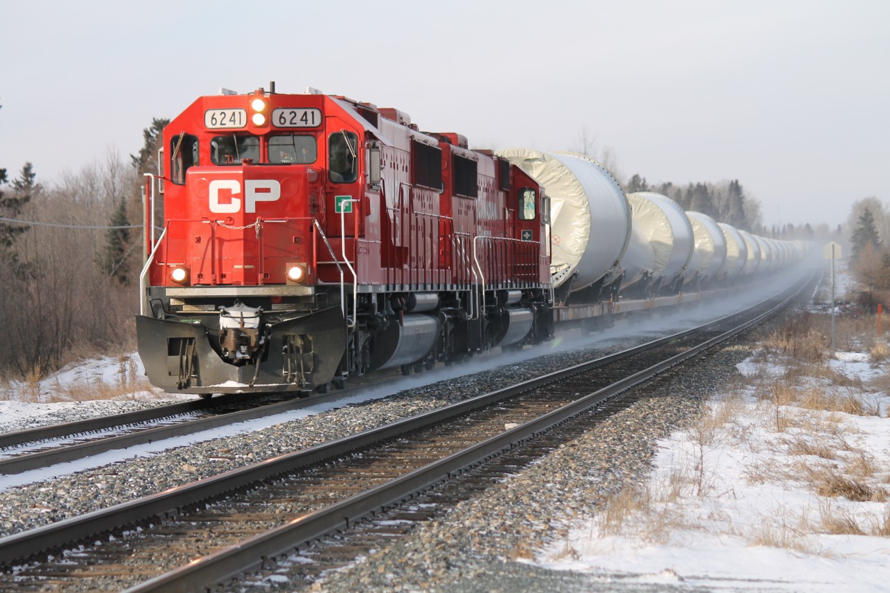 CP 6241 and sister CP 6240, former SOO units recently repainted into CP colours, head up a string of W-10 windmill towers eastward bound for Welland, ON.