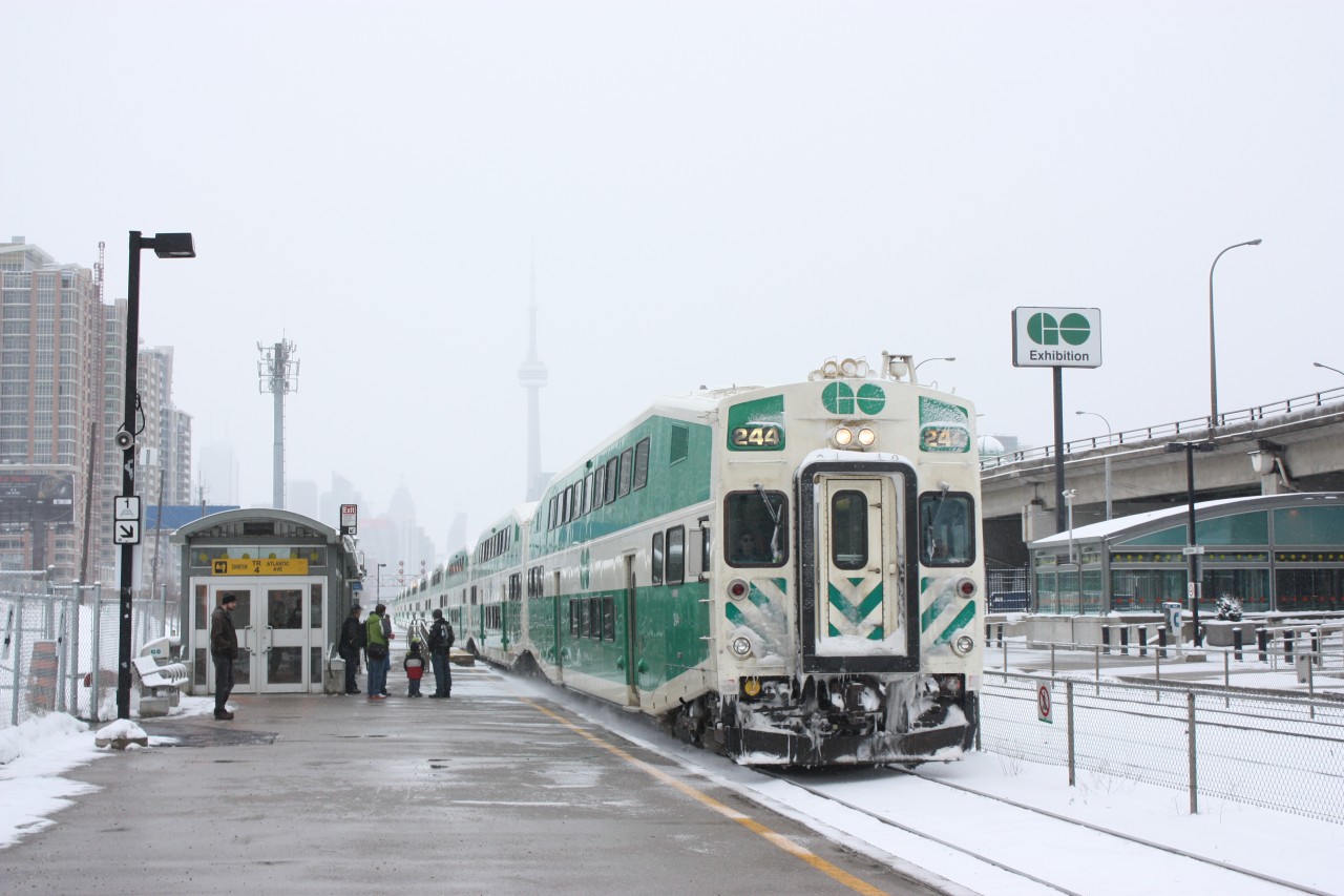 Go Transit westbound makes a brief station stop at the Exhibition stop.