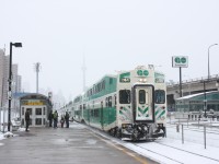 Go Transit westbound makes a brief station stop at the Exhibition stop.
