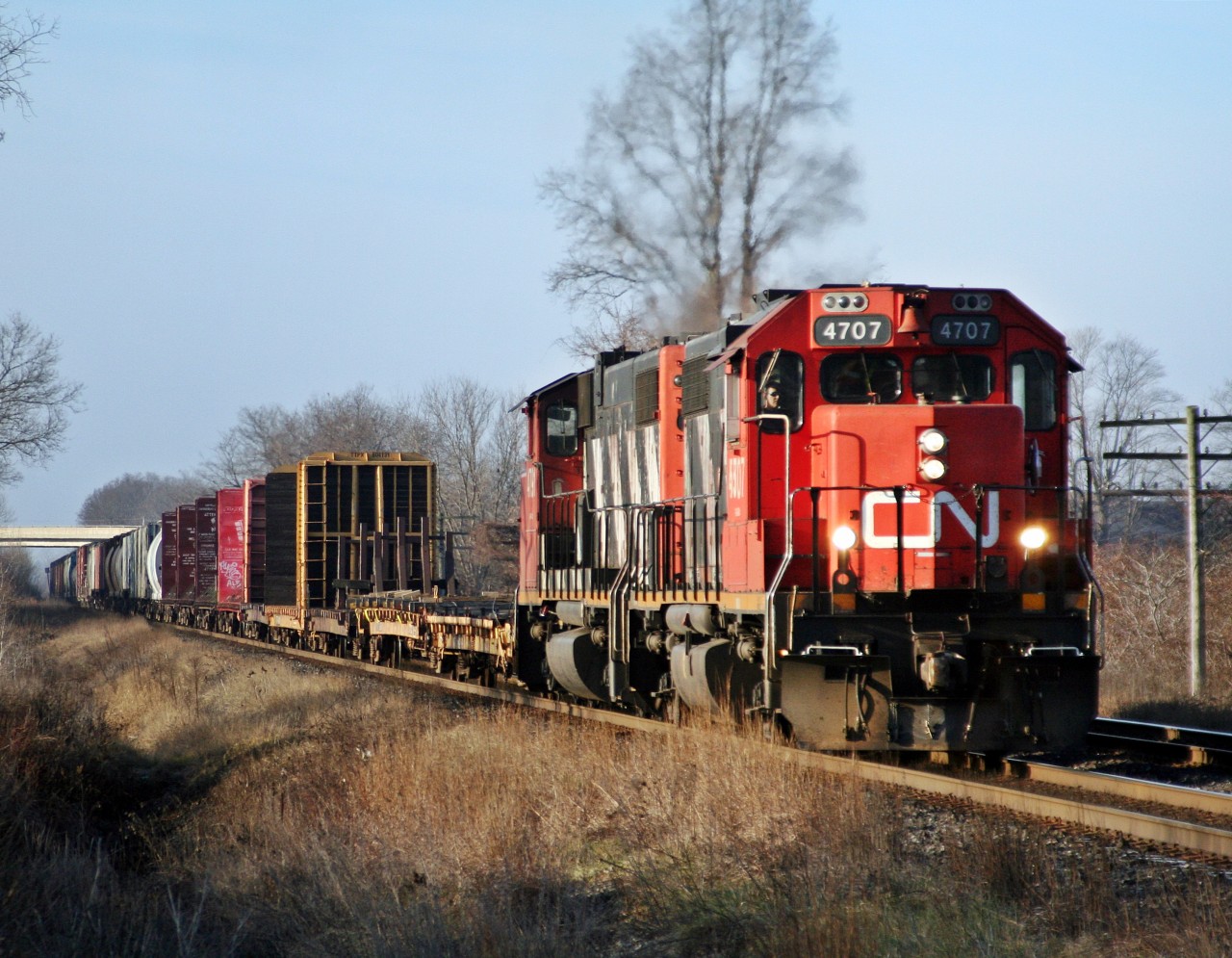 Coming from Windsor Ontario, CN 438 is making good time as they head towards London. Once there, they will drop their train, move over one track and head back to Windsor as CN 439