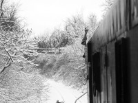 It's a winter wonderland as Trillium Railway S-13u #108 has a short train under control northbound on the Grantham Spur. <b>Photo taken on property with permission.</b>