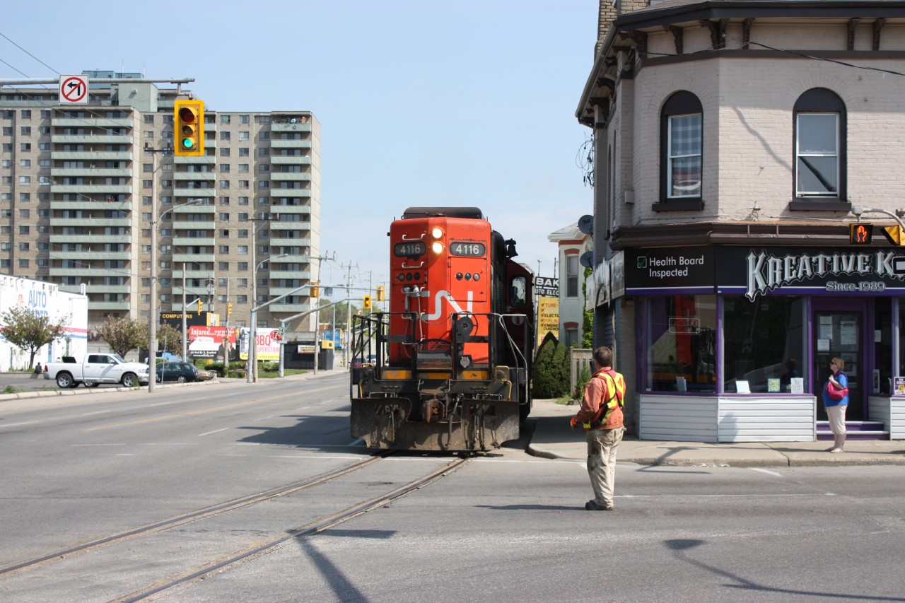 CN #580 street running in Brantford along Clarence St. on its way to serve the last two customers on the line.